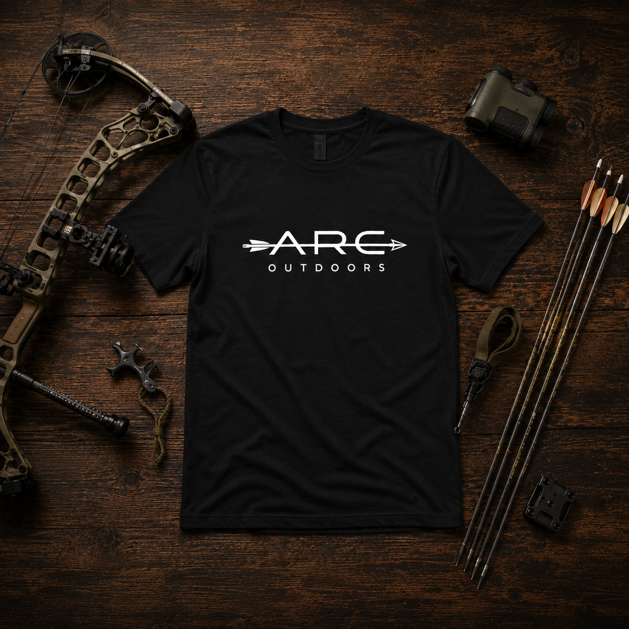 Black ARC Outdoors ARC tee with bow and archery accessories